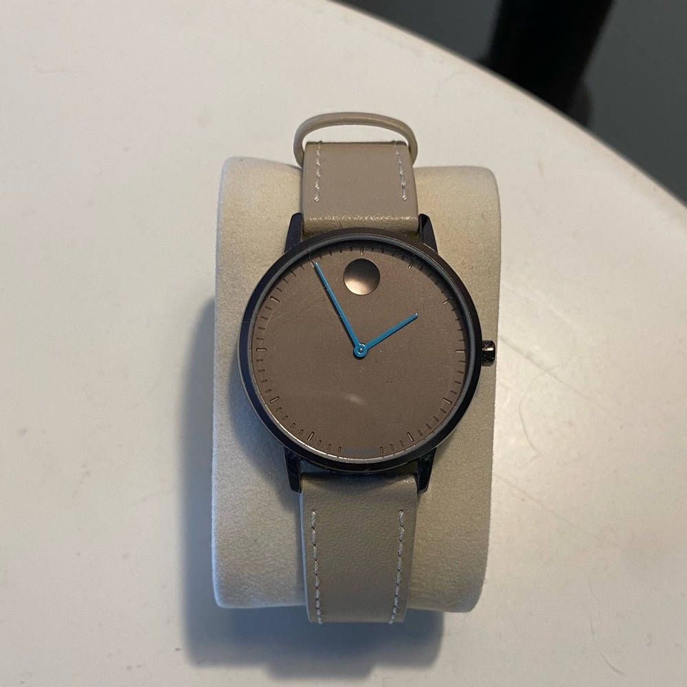 Movado womens watch. Tan with turquoise details.